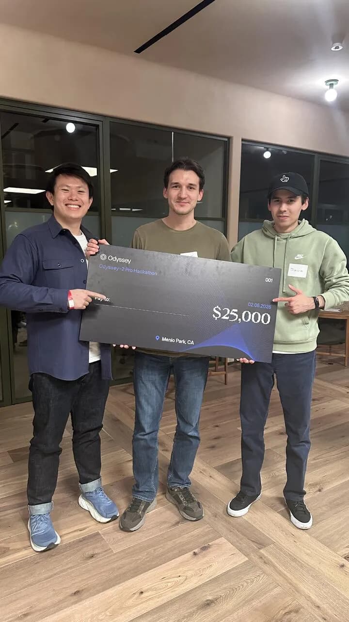 Oscar Hong, Mark Morgan and Javokhir Shomuratov holding the $25,000 Odyssey-2 Pro Hackathon winners' check in Menlo Park
